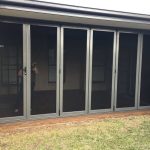 steel framed bi-fold doors leading to the side of the home - bi-fold screen doors toowoomba