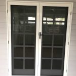 white framed french doors installed on home with Crimsafe in Toowoomba