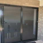 sliding door with black frames and smoke coloured window tint - sliding doors toowoomba