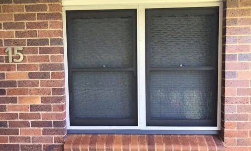 Window on brick home repaired with Crimsafe security mesh